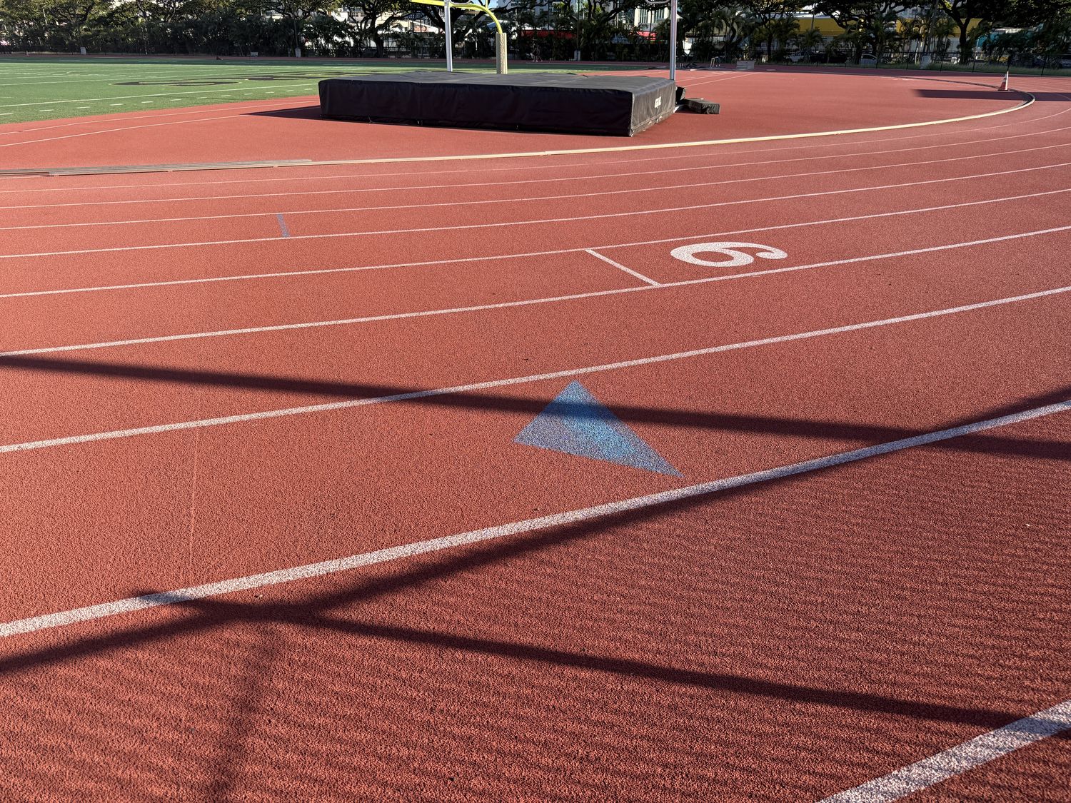 Track lane with blue triangle marker