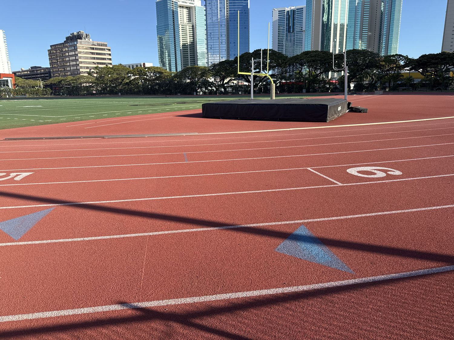 Track lanes with Honolulu skyline and buildings