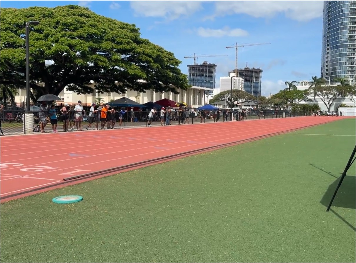 Track meet in Hawaii with athletes and spectators