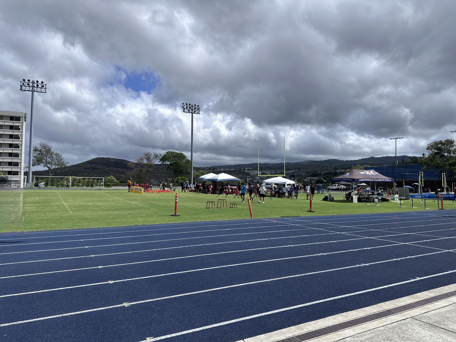 Track meet with canopy tents