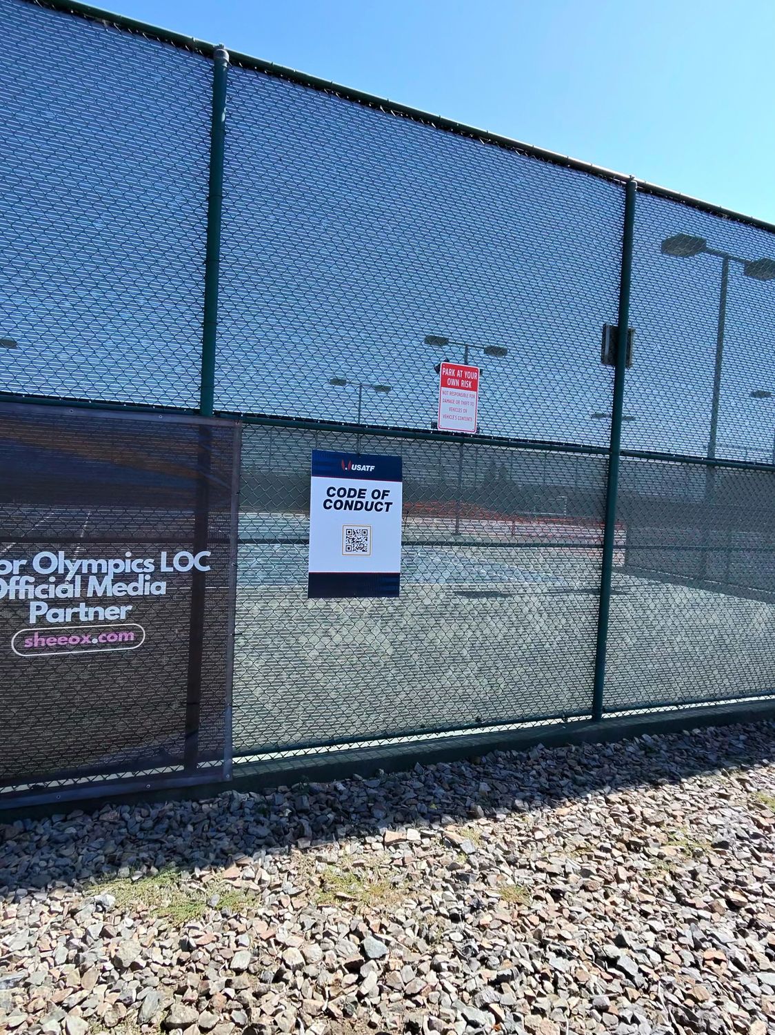 USATF Code of Conduct sign posted on the venue fence at Cerritos College