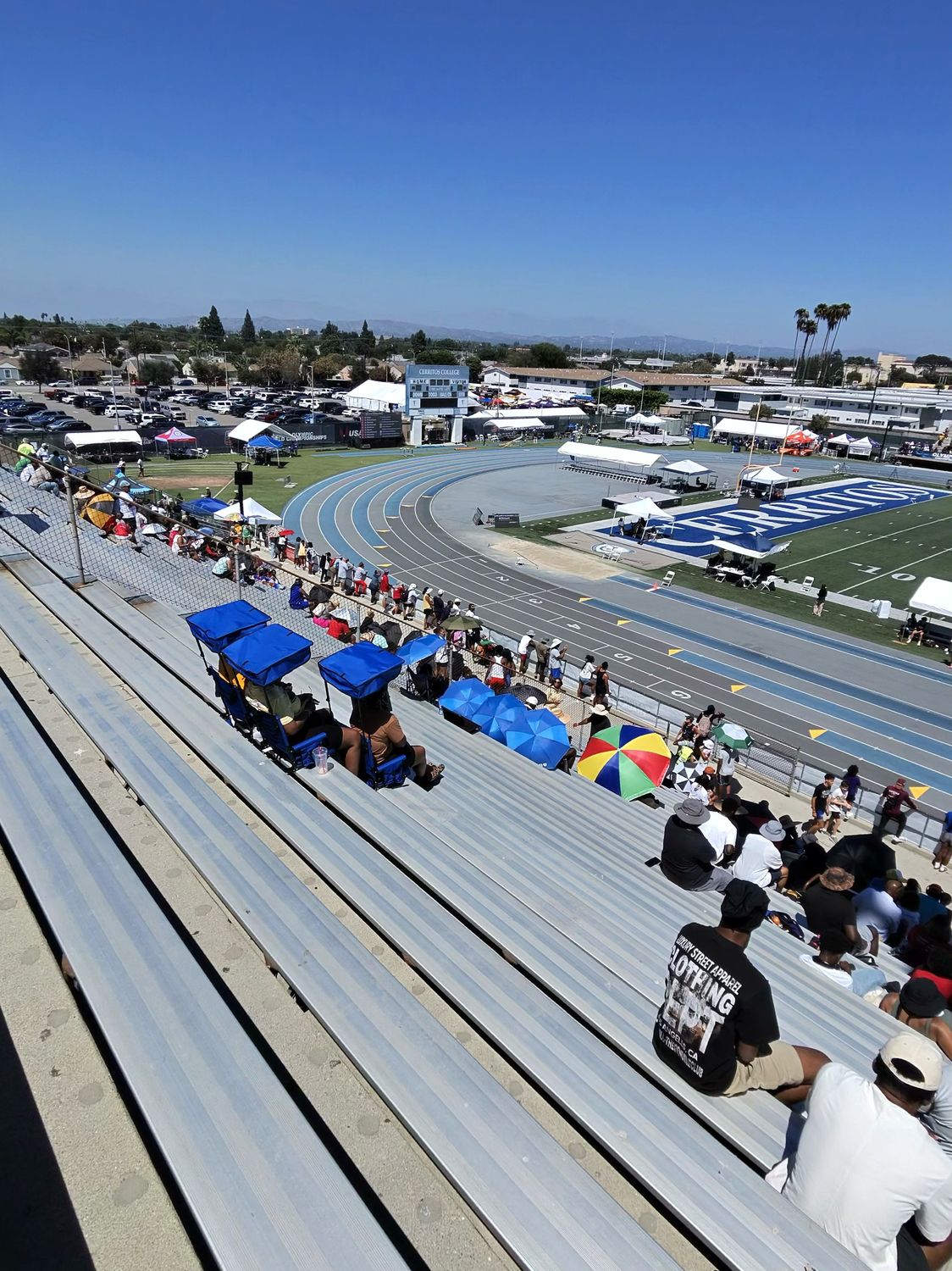 Another angle of stadium seats with shade canopies in the bleachers